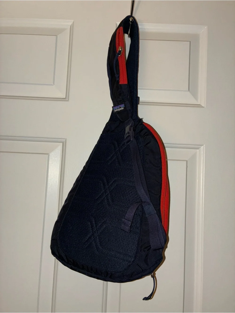 Patagonia Atom Sling 8L crossbody pack in a navy blue